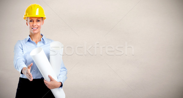 Smiling architect woman with handshake. Stock photo © Kurhan