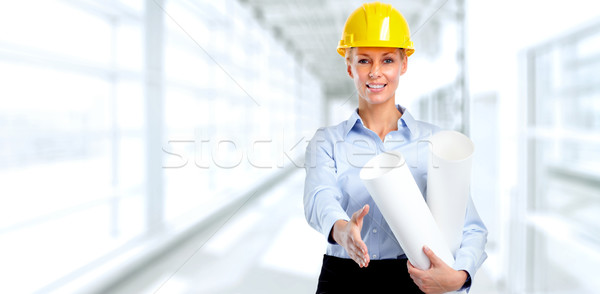 Smiling architect woman with handshake. Stock photo © Kurhan