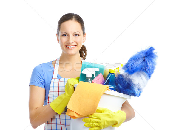 Dona de casa jovem sorridente limpador branco mulher Foto stock © Kurhan