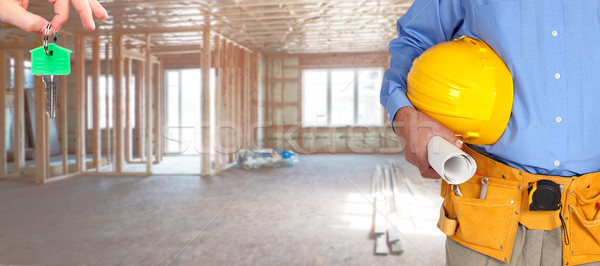 Construction worker with helmet and tool belt. Stock photo © Kurhan