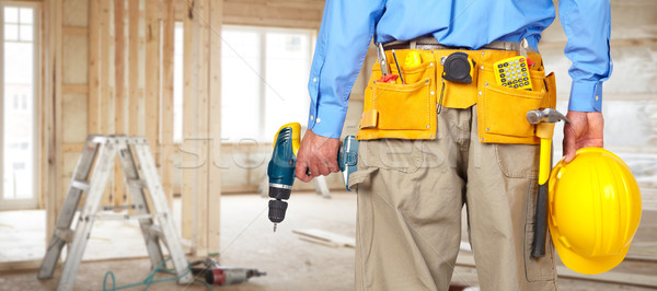 [[stock_photo]]: Travailleur · de · la · construction · casque · forage · outil · ceinture