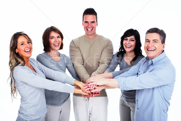 Grupo feliz a la gente tomados de las manos junto aislado blanco Foto stock © Kurhan