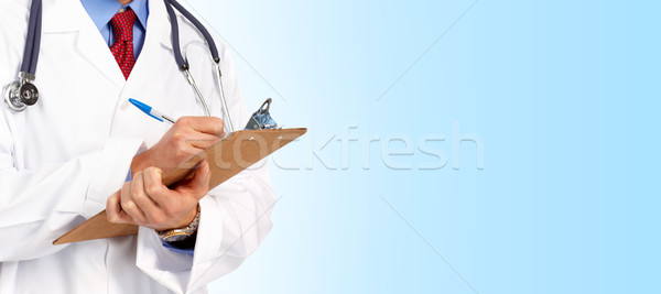 醫生 醫生 聽筒 寫作 藍色 健康 商業照片 © Kurhan