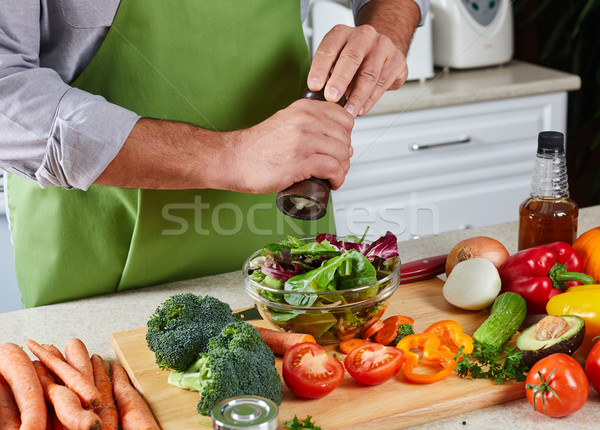 Chef man cooking in the kitchen. Stock photo © Kurhan