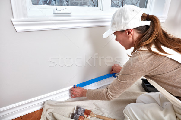 Stock photo: Woman painting wall