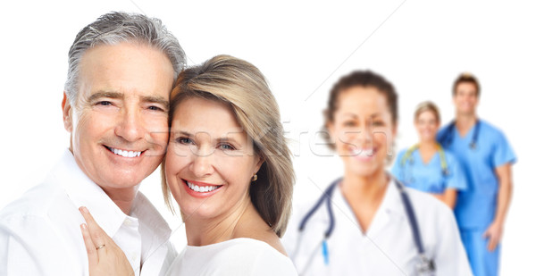 Medical doctor and elderly couple patient. Stock photo © Kurhan