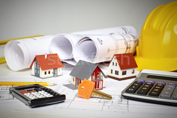 Little house and calculator on the table. Stock photo © Kurhan