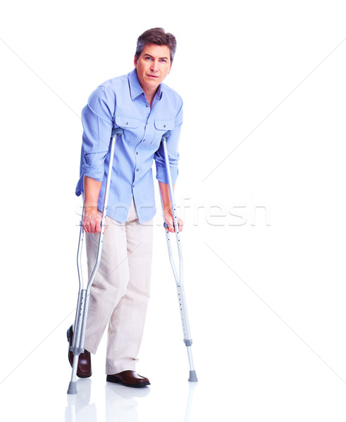 Man with crutch. Stock photo © Kurhan