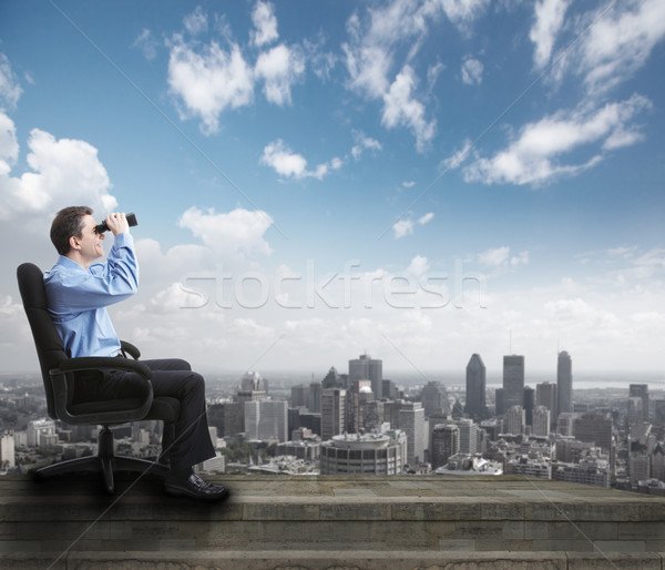 Stock photo: Businessman with binoculars.
