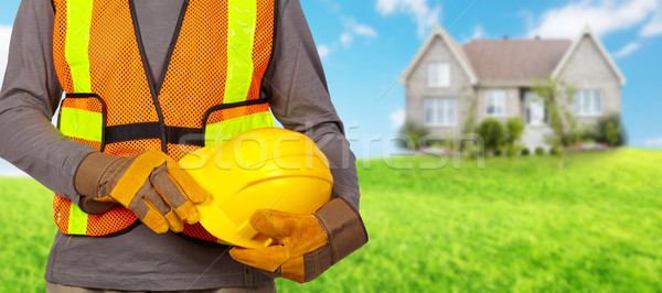 Trabajador casco naranja seguridad chaleco trabajador de la construcción Foto stock © Kurhan