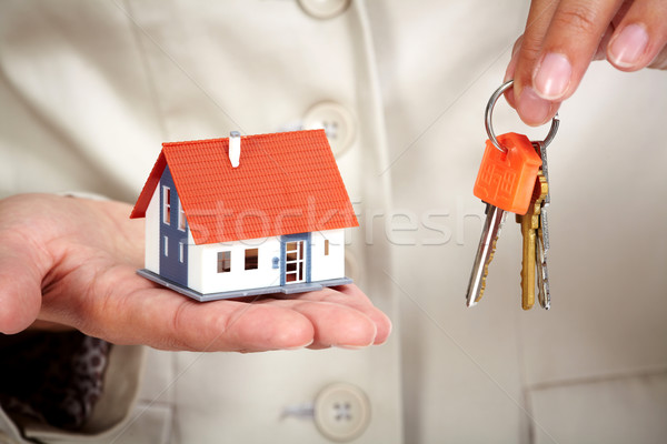 Woman Hands with little house and key. Stock photo © Kurhan