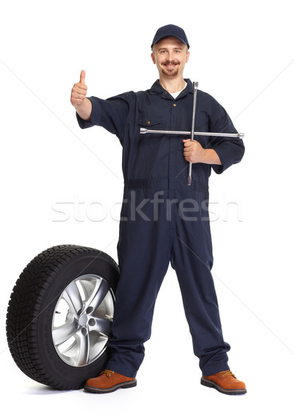 Car mechanic with a tire wrench. Stock photo © Kurhan