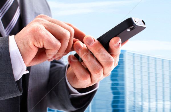 Businessman calling by phone. Stock photo © Kurhan