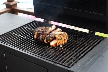 Stock photo: Salmon fish roasted on barbecue grill.
