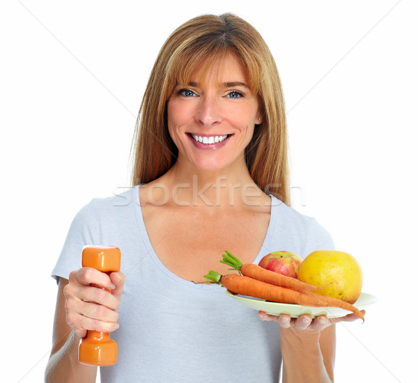 Healthy woman with dumbbell and fruits. Stock photo © Kurhan