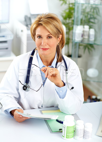 Mature doctor woman with pills. Stock photo © Kurhan