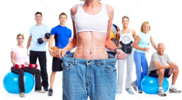 Slimming woman wearing big pants. Stock photo © Kurhan