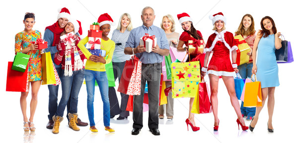 Group of happy Christmas people with gifts. Stock photo © Kurhan