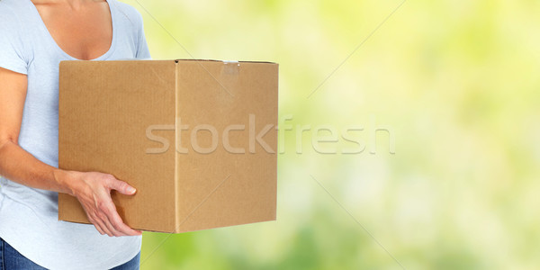 Woman with moving box. Stock photo © Kurhan
