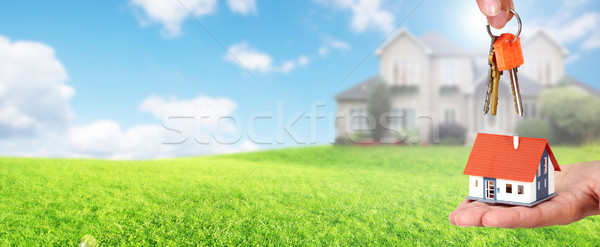 Hand with a little house and keys. Stock photo © Kurhan
