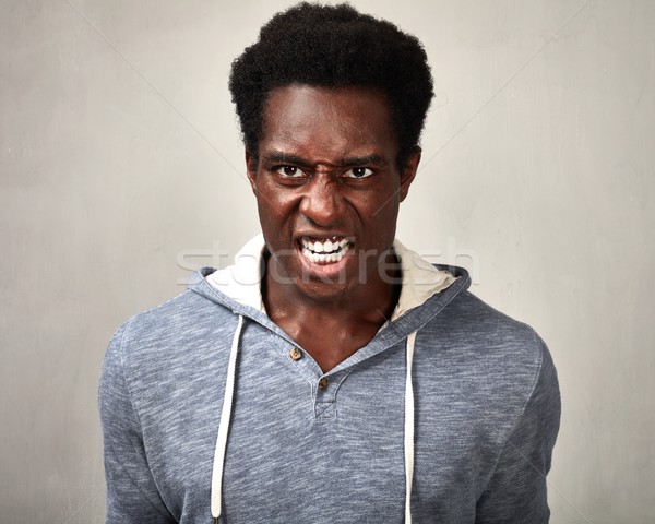 Angry black man. Stock photo © Kurhan