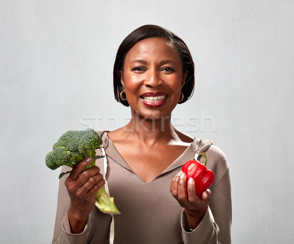 African american woman with broccoli Stock photo © Kurhan