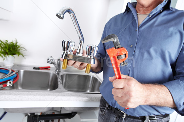 Plombier clé mains professionnels robinet d'eau construction Photo stock © Kurhan