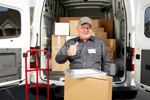 Mature delivery man with a parcel. stock photo © Kurhan (#7321711) |  Stockfresh
