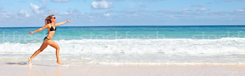 Woman running on the beach Stock photo © Kurhan