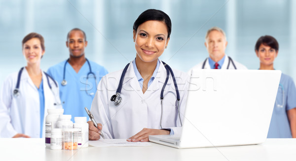 Asian Doctor woman with pills. Stock photo © Kurhan