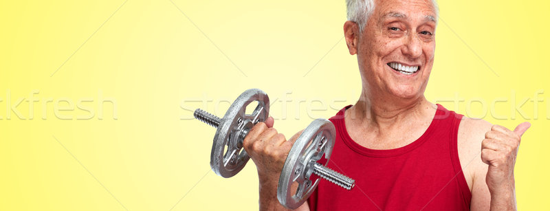 Senior man with dumbbell. Stock photo © Kurhan