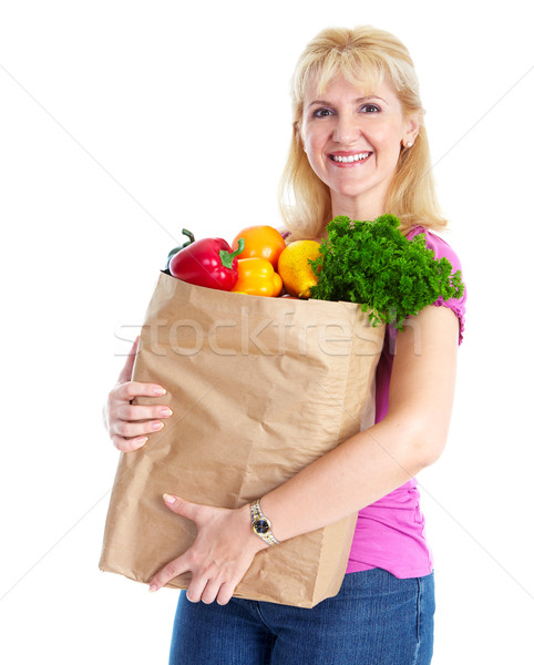 Stock photo: Young woman with a grocery shopping bag.