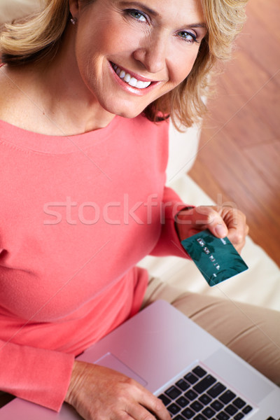 Woman with laptop and a credit card. Stock photo © Kurhan
