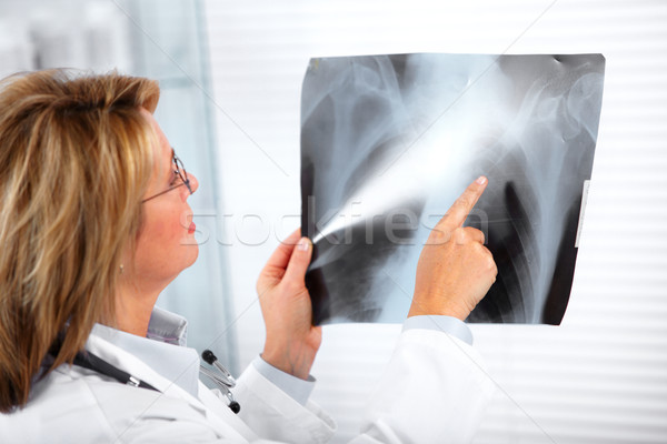 Mature doctor woman with a X-ray photograph. Stock photo © Kurhan