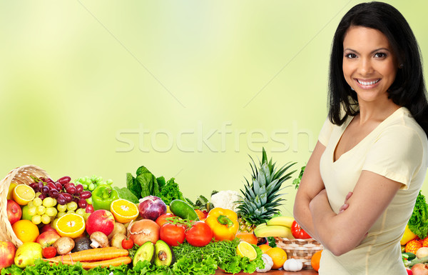 Stock photo: Young woman with vegetables and fruits.