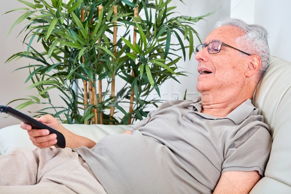 Senior man watching tv Stock photo © Kurhan