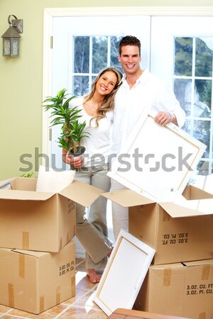 Pareja jóvenes sonriendo nuevos moderna casa Foto stock © Kurhan