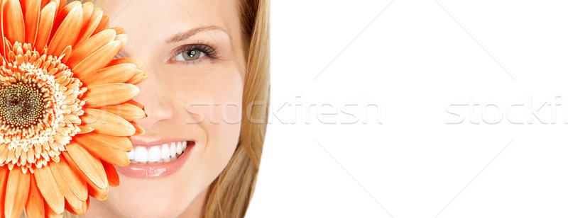 Beautiful woman smile with flower. Stock photo © Kurhan