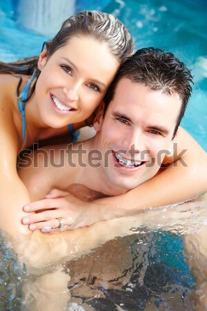 Young couple relaxing in jacuzzi. Stock photo © Kurhan
