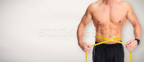 Hombre abdomen cinta métrica azul fuerte Foto stock © Kurhan