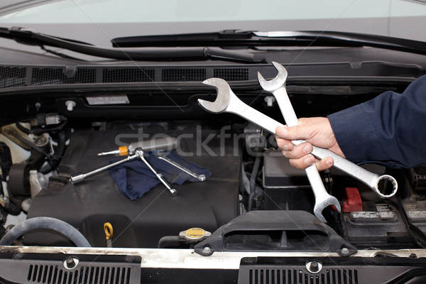 Hands of auto mechanic with wrench. Stock photo © Kurhan