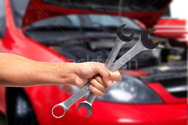 Hand of car mechanic with wrench. Stock photo © Kurhan