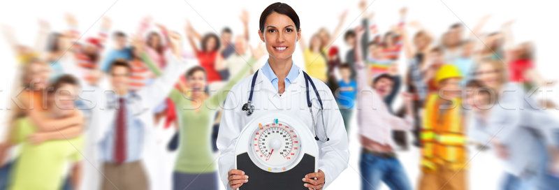 Medical doctor woman with scales. Stock photo © Kurhan