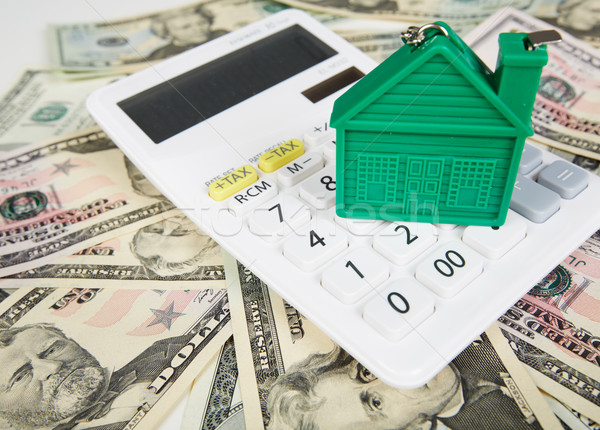 House money and calculator. Stock photo © Kurhan