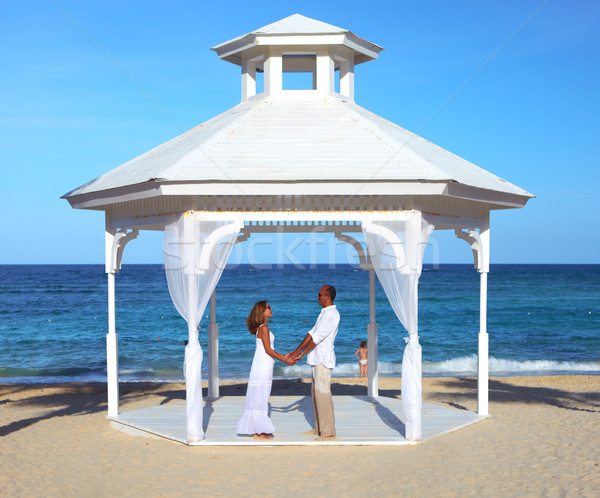 Stock photo: Loving couple in belvedere on the beach