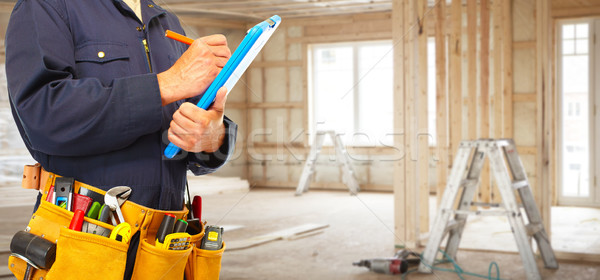 Builder handyman with construction tools. Stock photo © Kurhan