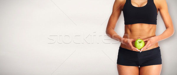 Tineri femeie de fitness abdomen măr dieta Imagine de stoc © Kurhan