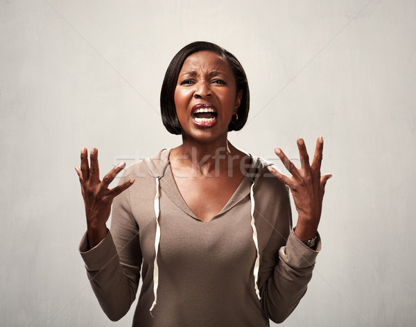 Angry african american woman Stock photo © Kurhan