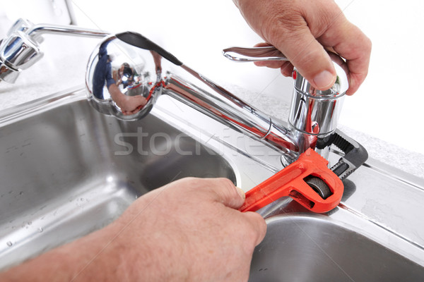 Plumber with a wrench. Stock photo © Kurhan