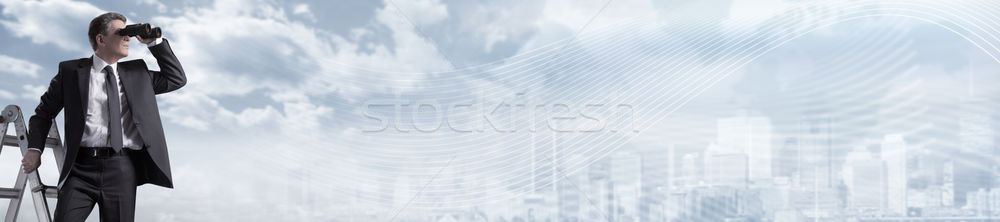 Businessman with binoculars. Stock photo © Kurhan